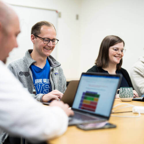 Students looking at computers